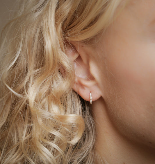 Why do my earrings turn black?